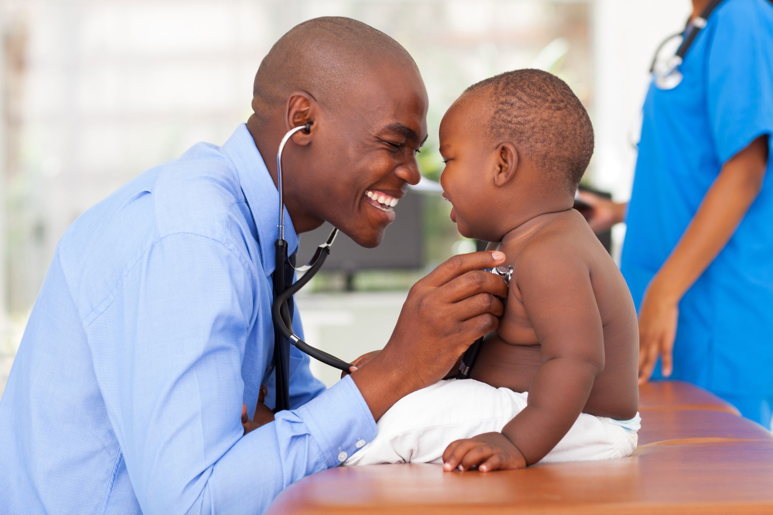 doctor examining child