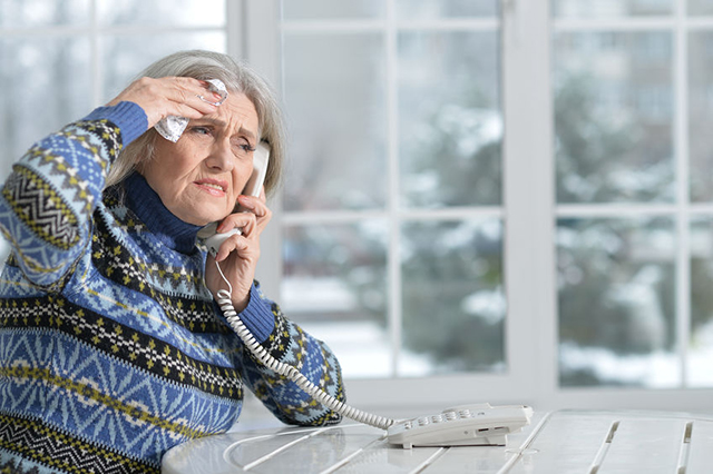 senior lady distressed on the phone